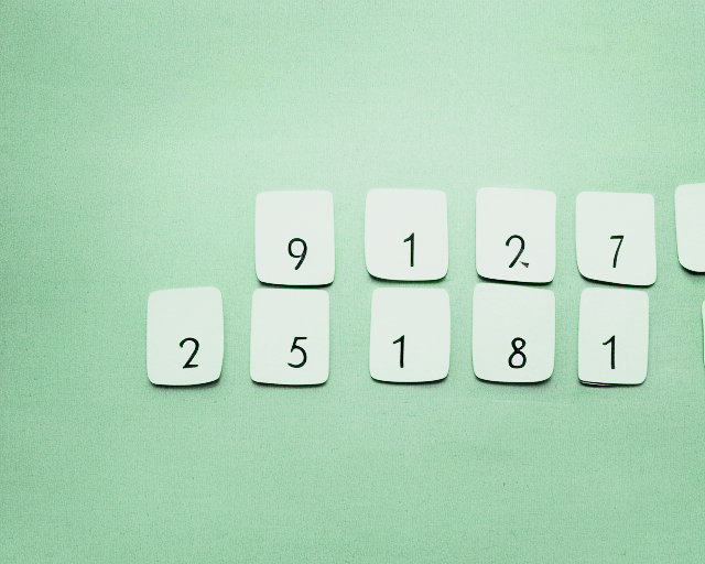 Numbered cards arranged on a green background