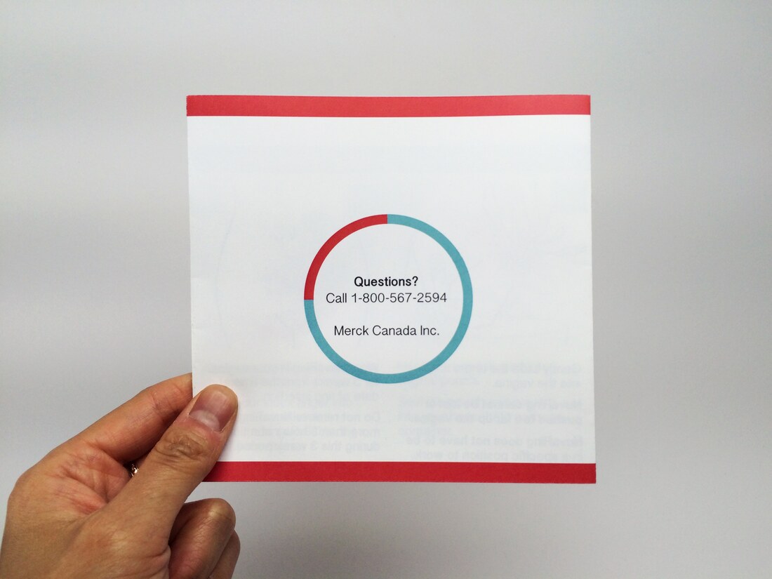 The back of the redesigned ‘My NuvaRing’ quick reference guide with a questions line, held in two hands