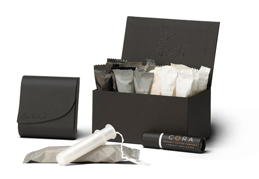 The Cora signature kit: a slim case and box for holding organic cotton tampons